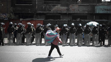 Supporters of ex-Bolivia leader Morales block roads over possible arrest