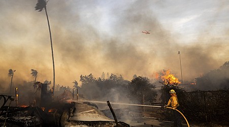 Slower winds aid firefighters battling destructive blaze in Southern California