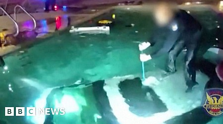 Watch: Moment police officer rescues man trapped in submerged car