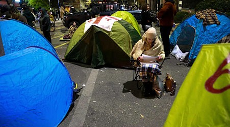 Protesters in Georgia's capital set up a tent camp on the main street and call for new elections