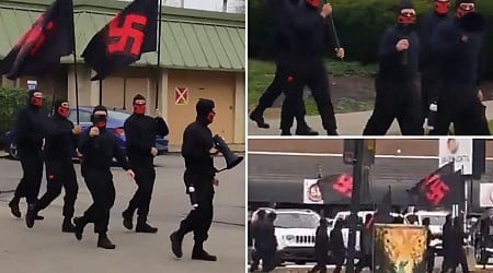 Masked group marches in Ohio community with swastika flags