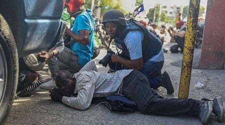 Residents in Haiti's capital stand with police in a battle to repel the latest gang attack