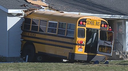 Holmen school bus crashes into home, no kids on board