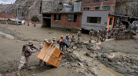 Heavy rains in Bolivia send mud crashing into the capital, leaving 1 missing and destroying homes