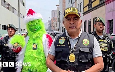 Watch: Police officer dressed as the Grinch leads drug raid