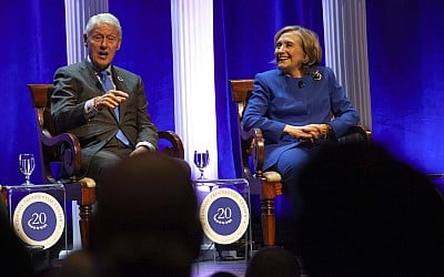 Bill Clinton is hospitalized with a fever but in good spirits, spokesperson says