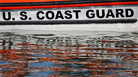 Coast Guard is searching for 5 people after a boat capsized in seas off Alaska