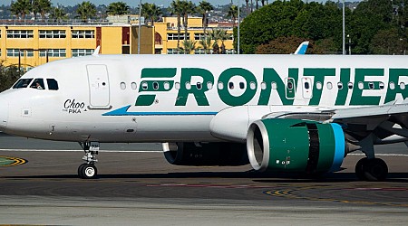 A group of Frontier Airlines passengers are suing, saying they were kept on a 'smoke-filled' plane for nearly an hour