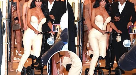 Kim Kardashian scoots on knee walker as she refuses to ditch heels with broken foot