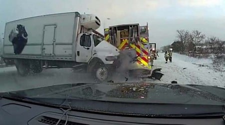 Caught on camera: Box truck crashes into first responder vehicles helping clear another crash on I-94