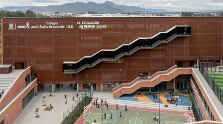 Nómena Arquitectura shades school in Bogotá with perforated metal panels