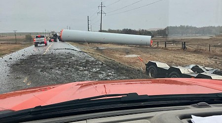 Semi hauling windmill tower loses load on K-156 highway