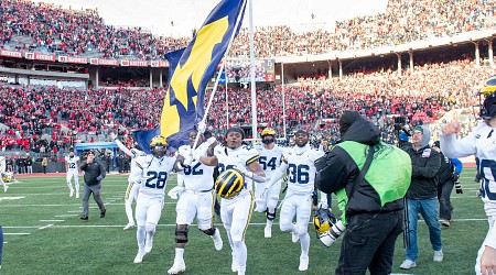 Video: Sherrone Moore Trolls Ohio State with Flag-Plant Gesture at Michigan CBB Game