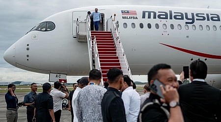 Anwar returns home from four-country visit