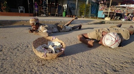 Cubans crawl on rough roads to ask for good fortune