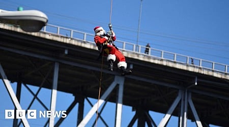 Watch: Abseiling Santa descends from Guatemala bridge to deliver toys