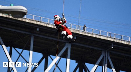 Watch: Abseiling Santa descends from Guatemala bridge to deliver toys