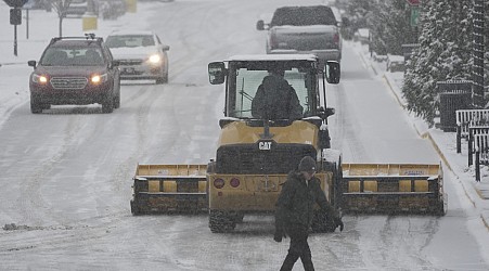 Snowstorms close schools and offices across a large swath of the U.S.