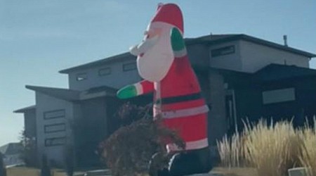 WATCH: Giant inflatable Santas take over Utah neighborhood