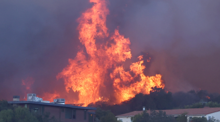 California wildfires rage across Los Angeles County, forcing thousands to evacuate their homes