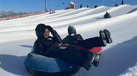 Scarves over headscarves, Muslim women’s outdoors group tackles snow tubing in Minnesota