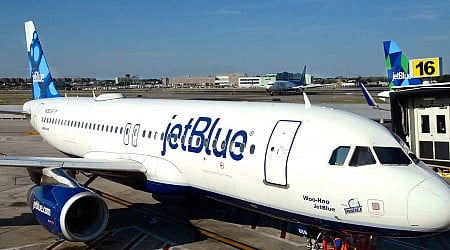 A JetBlue passenger opened the plane's emergency exit after reportedly arguing with his girlfriend