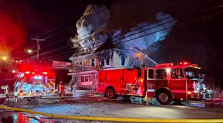 Police officers rescue 3 people stranded on the roof of a burning building in NH