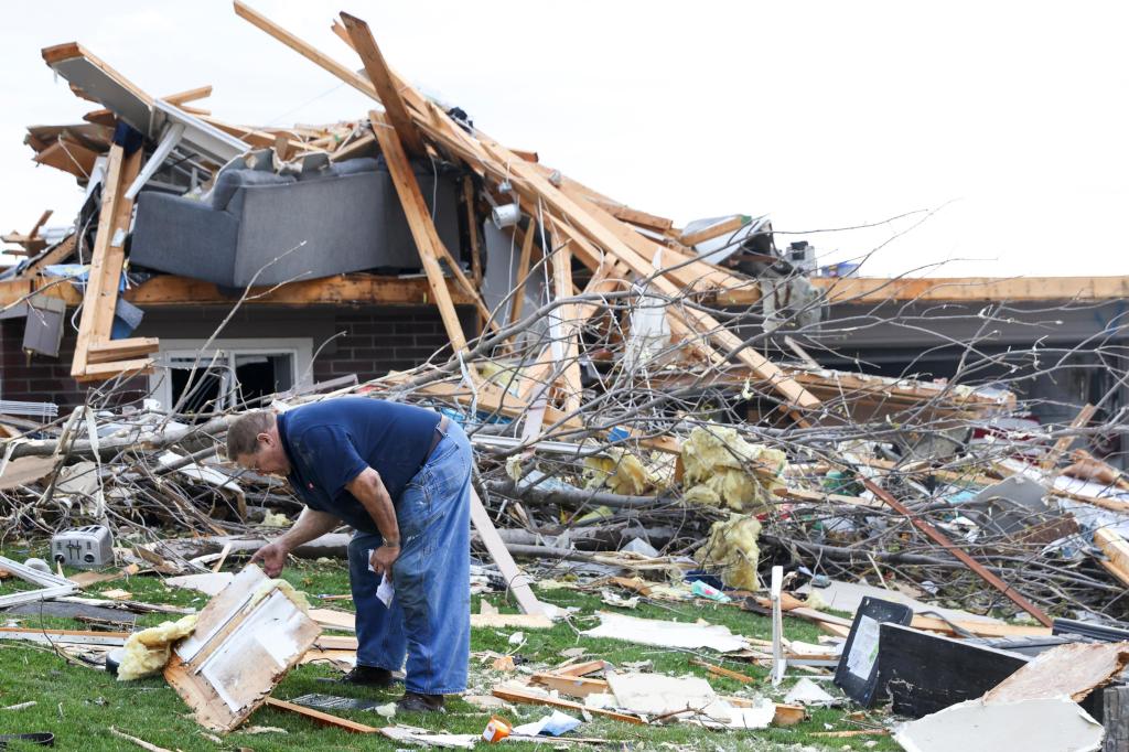Residents go through the rubble after tornadoes hammer Nebraska, Iowa