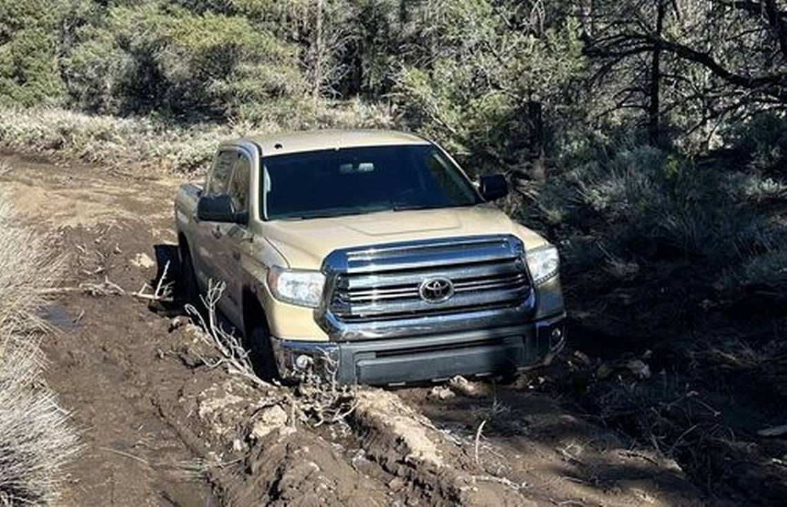 Driver gets stuck in mud on closed Death Valley road, photo shows. Rangers warn others