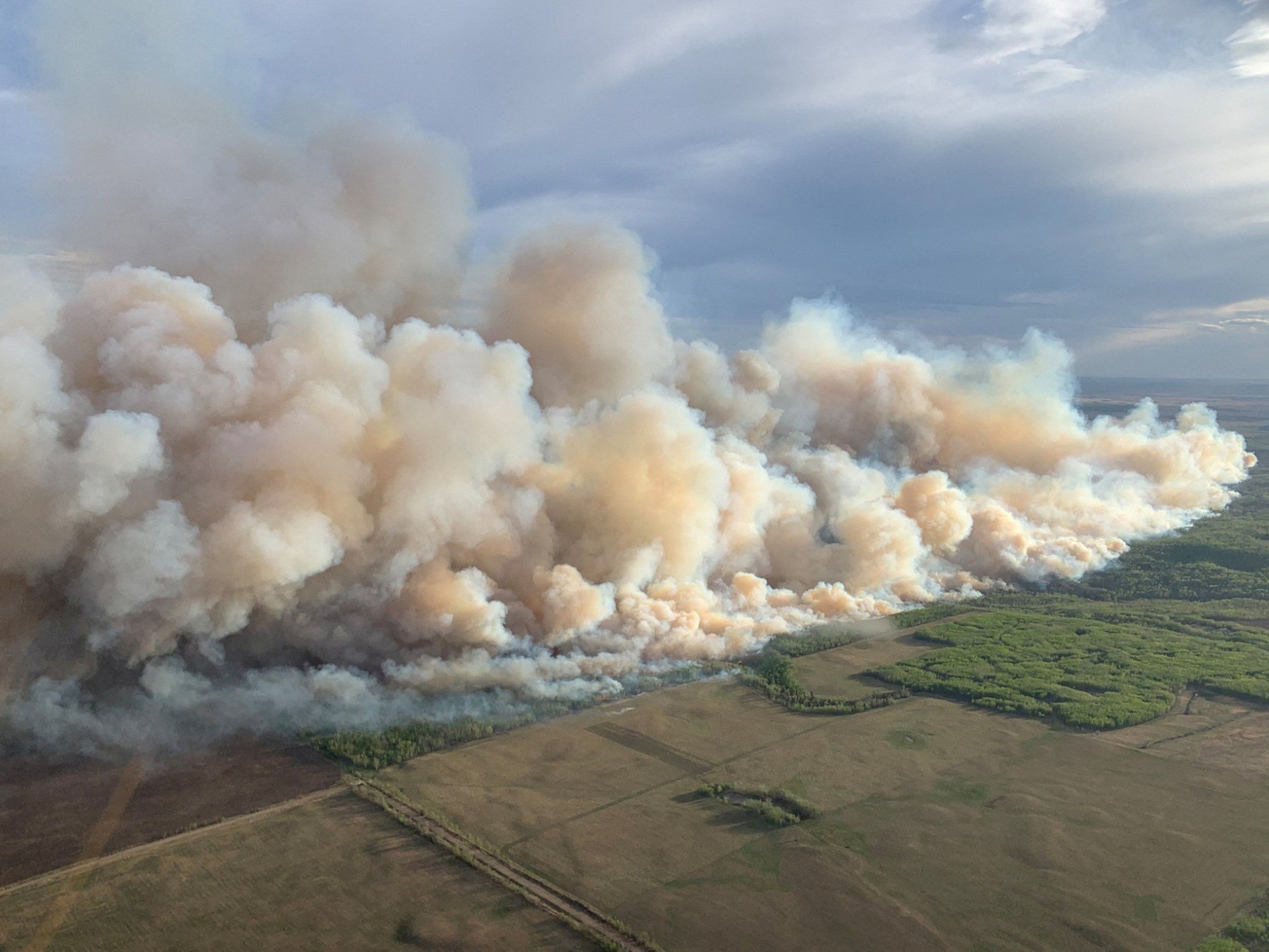 Wildfires spread across western Canada