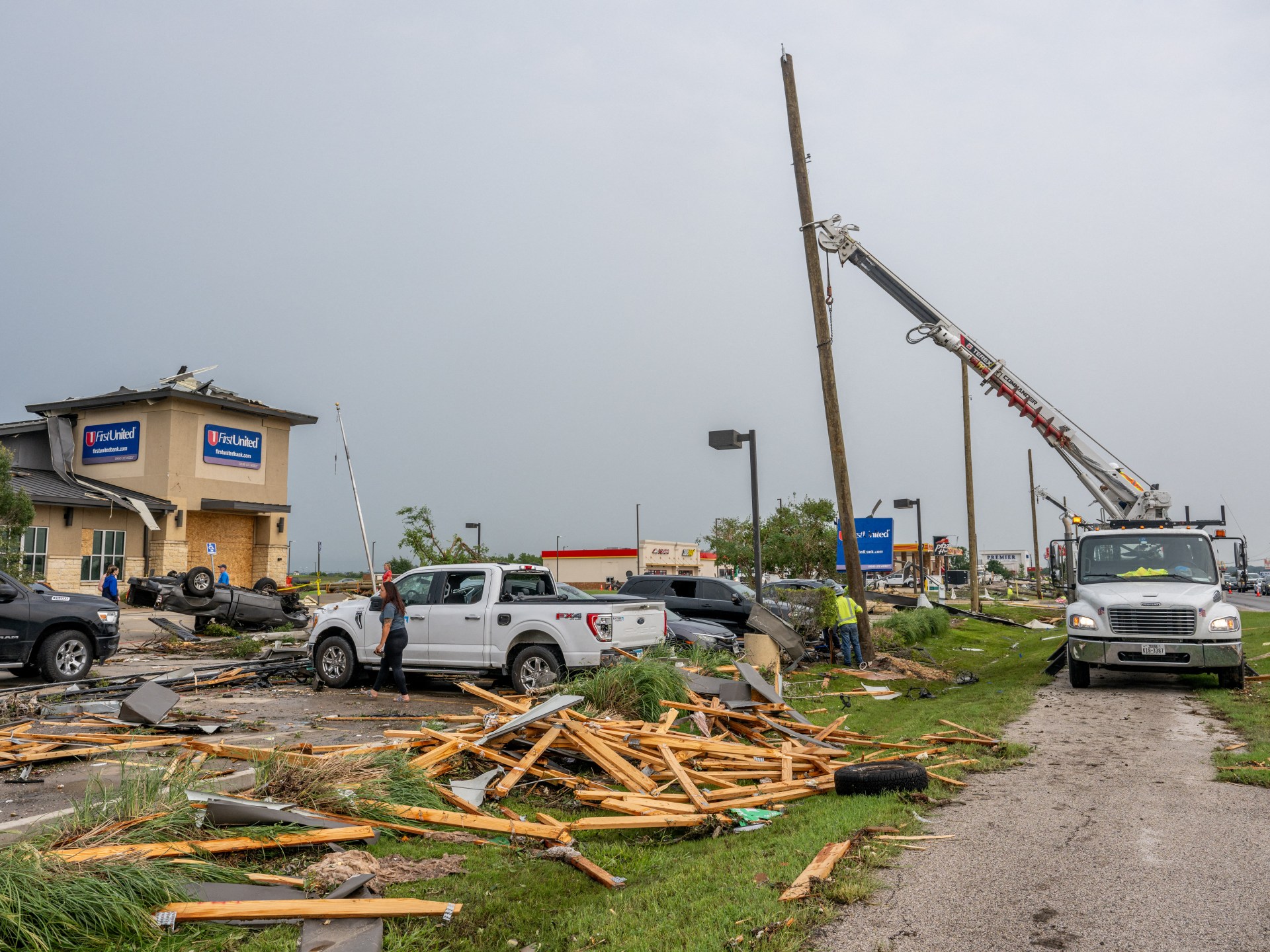 At least 11 people, including two children, killed in US tornadoes, storms