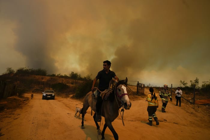 Chile accuses volunteer firefighter and ex-forestry official with causing huge fire that killed 137