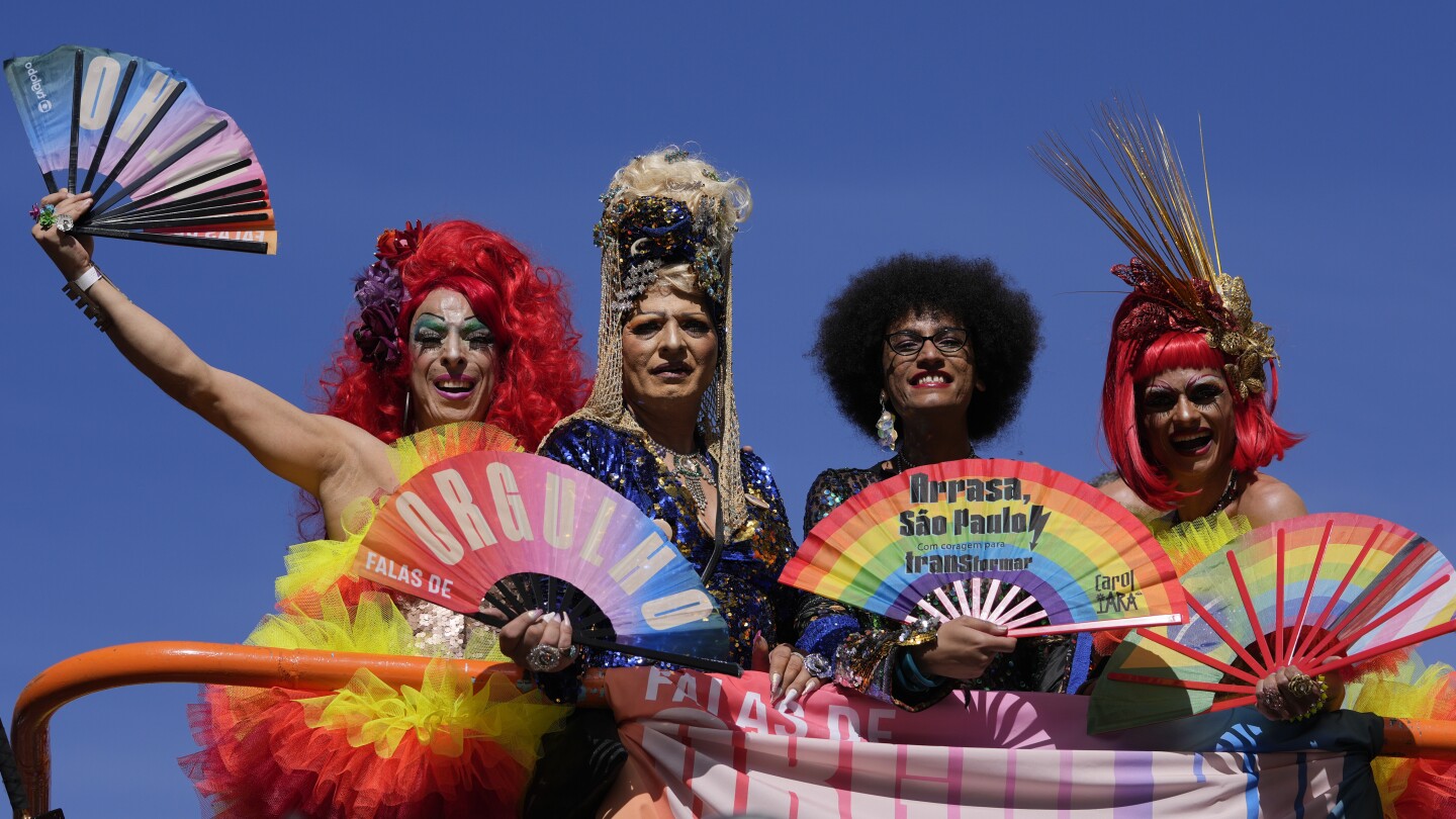 Gay pride revelers in Sao Paulo reclaim Brazil's national symbols