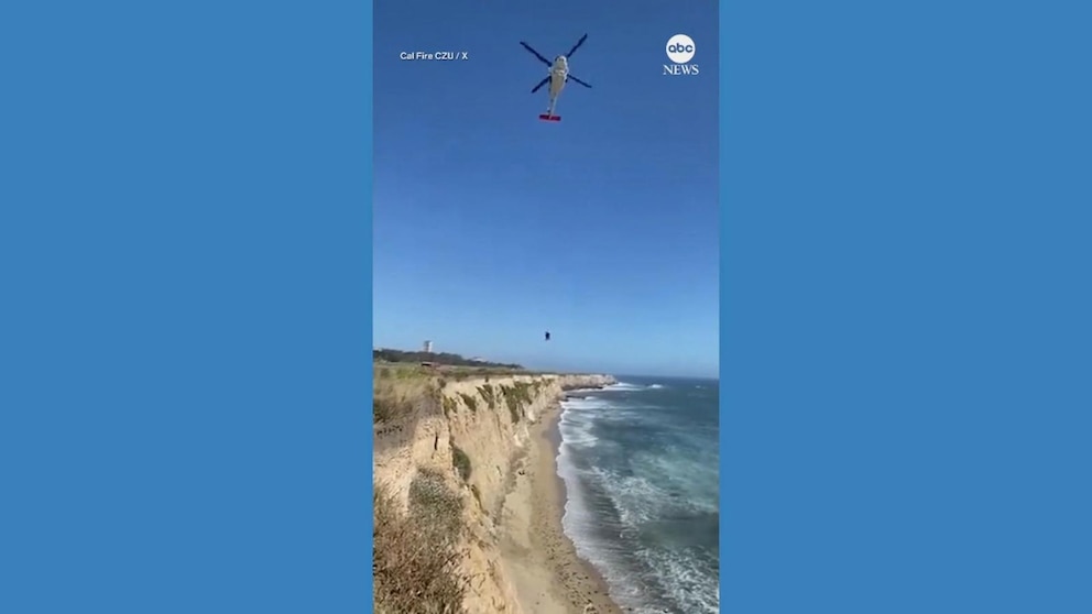 WATCH: Kite surfer stranded on beach uses rocks to spell out 'HELP' in the sand