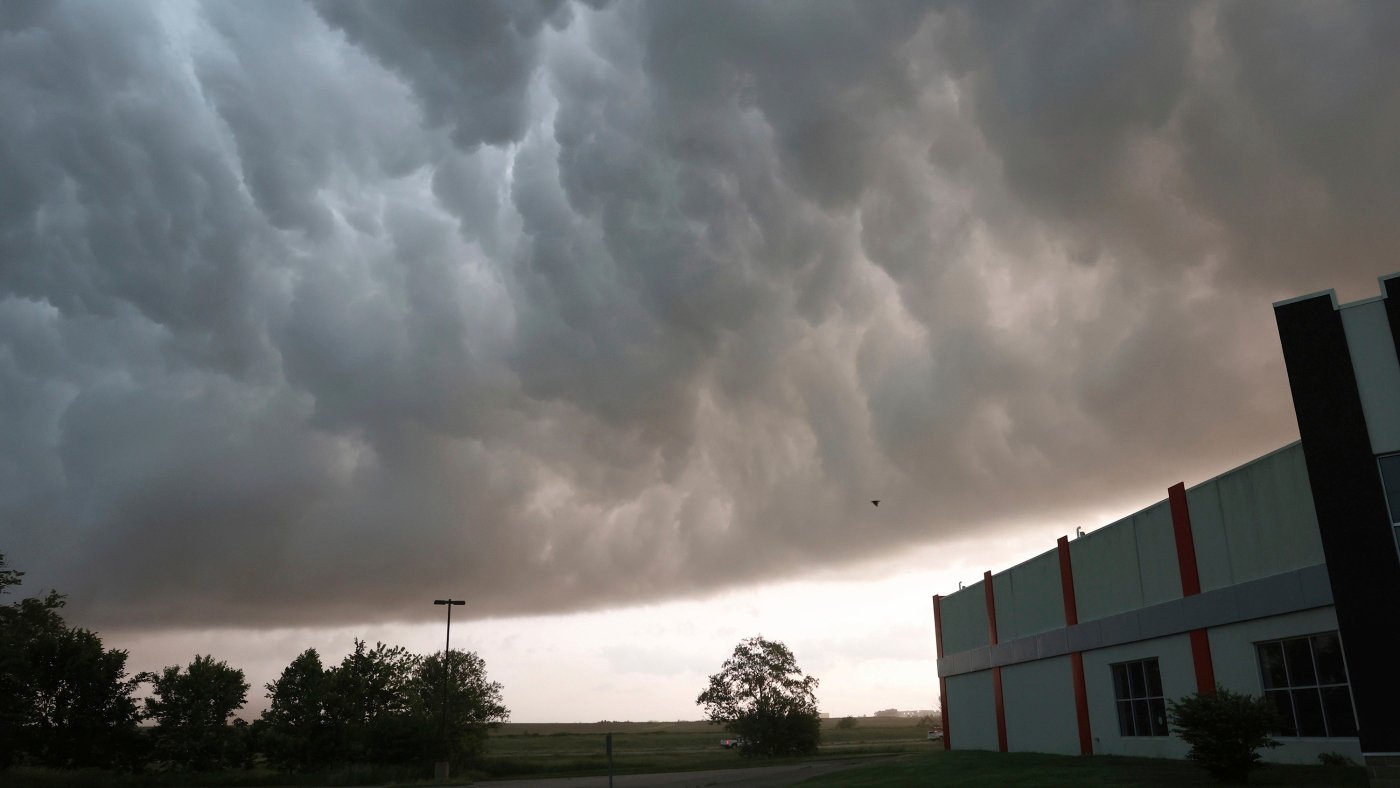 Tornado damages homes as Texas and Oklahoma residents told to seek shelter