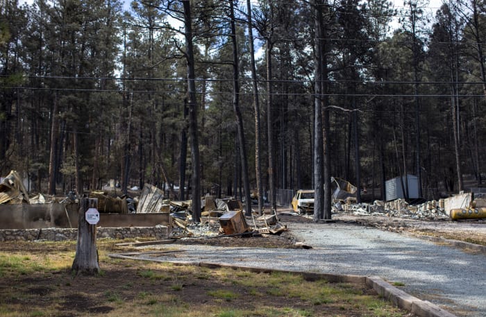 Team combs fire-ravaged New Mexico community for remains of the missing