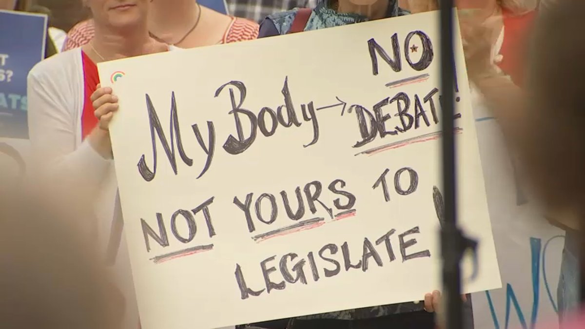Protesters oppose NH teacher's firing for allegedly taking student for abortion services