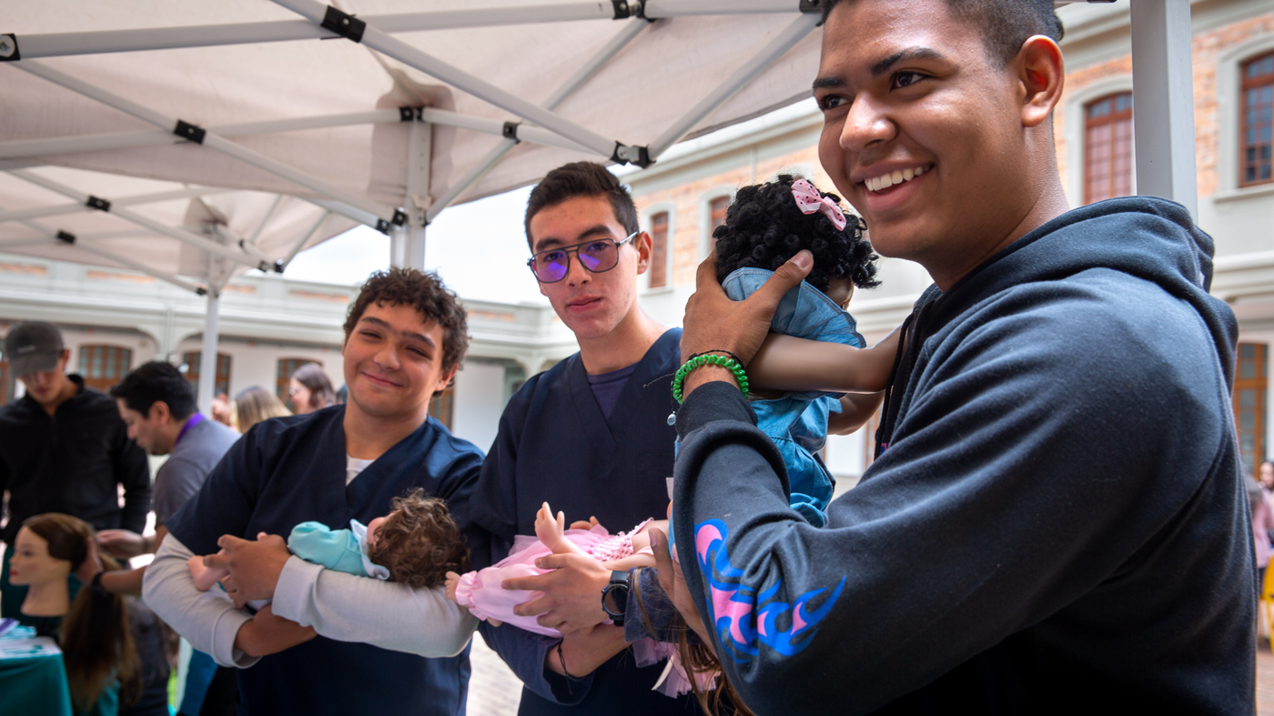 Wanna be a good dad? A 'School for Men' teaches diapering, ponytail making