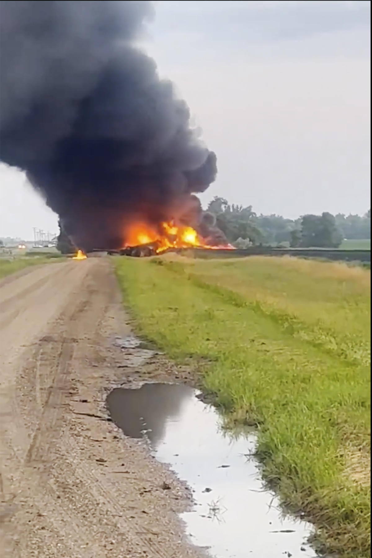Rail cars carrying hazardous material derail and catch fire in North Dakota