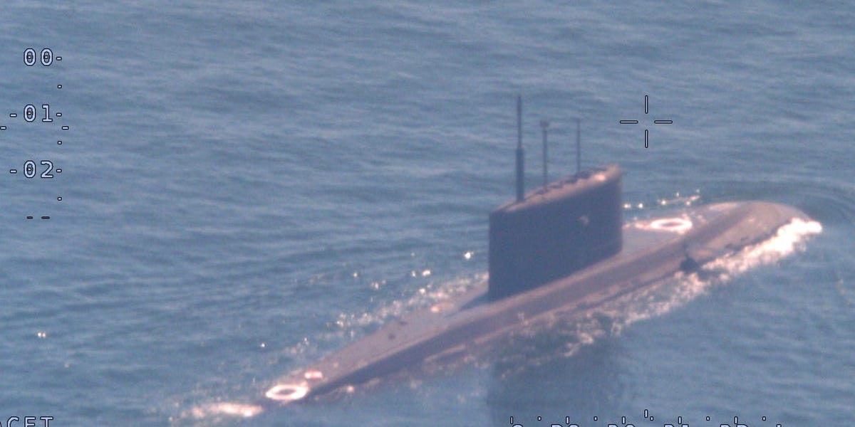 A NATO sub hunter captured these shots of a Russian submarine in waters newly surrounded by the alliance