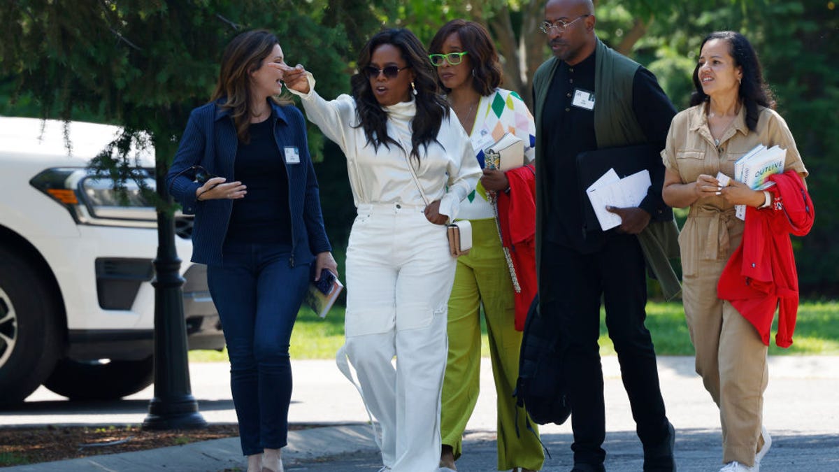 Oprah looks chic in white at billionaire summer camp