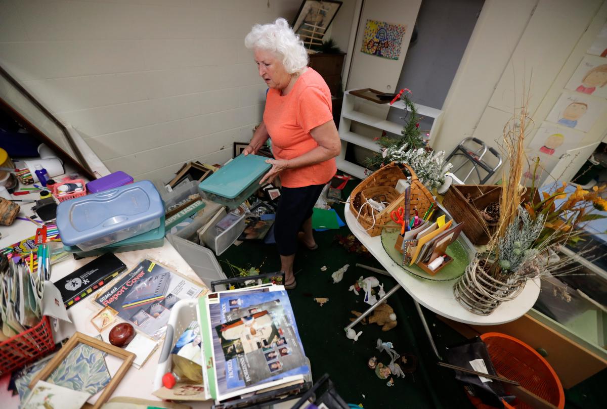 Families on Viola Street in Appleton dig out after flooding crashed their Fourth of July