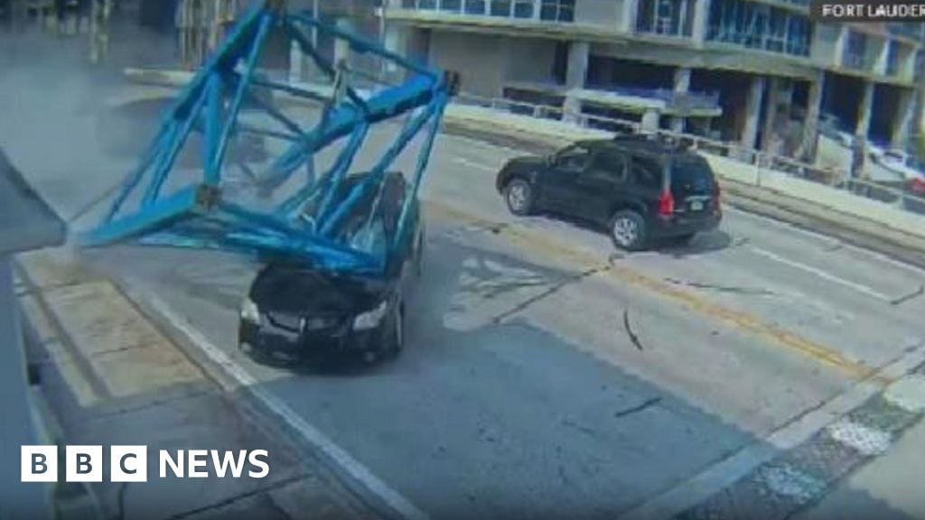 Moment woman escapes fatal crane collapse