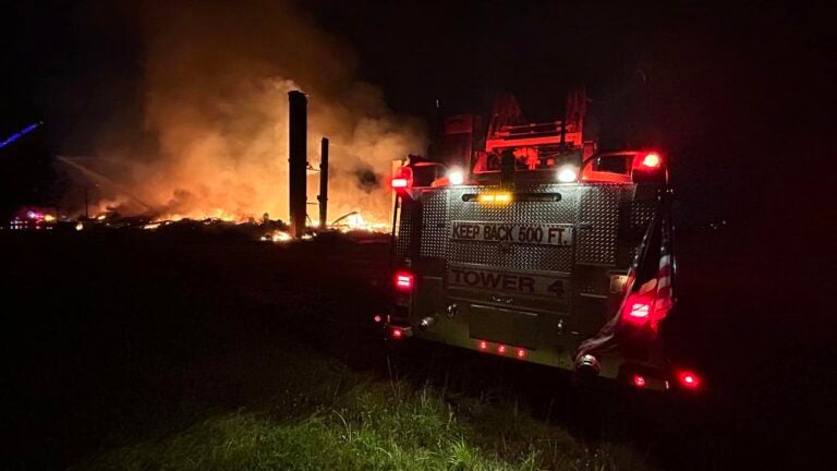 Large fire destroys mill building near Mass. border