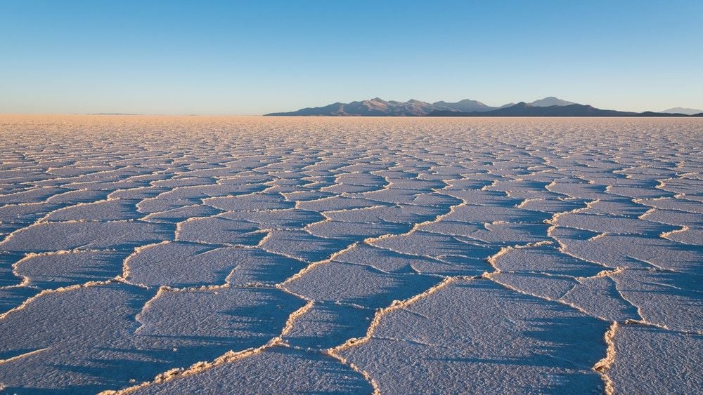 Salar de Uyuni: The world's largest salt desert and lithium reservoir surrounded by volcanoes