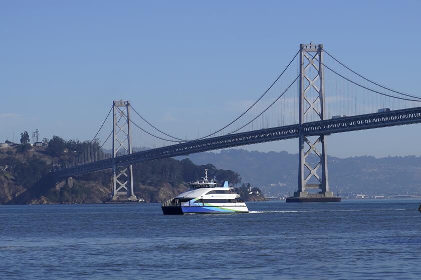 Driver fleeing car collision on Bay Bridge jumps off railing, and survives