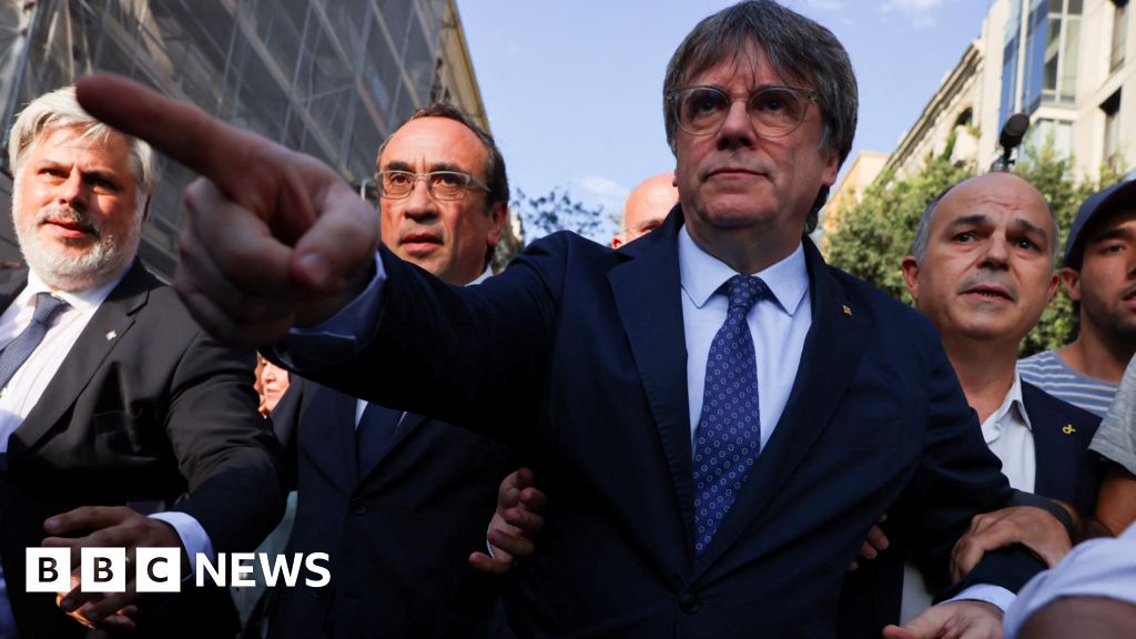 Police hunt ex-Catalan separatist leader after return from exile