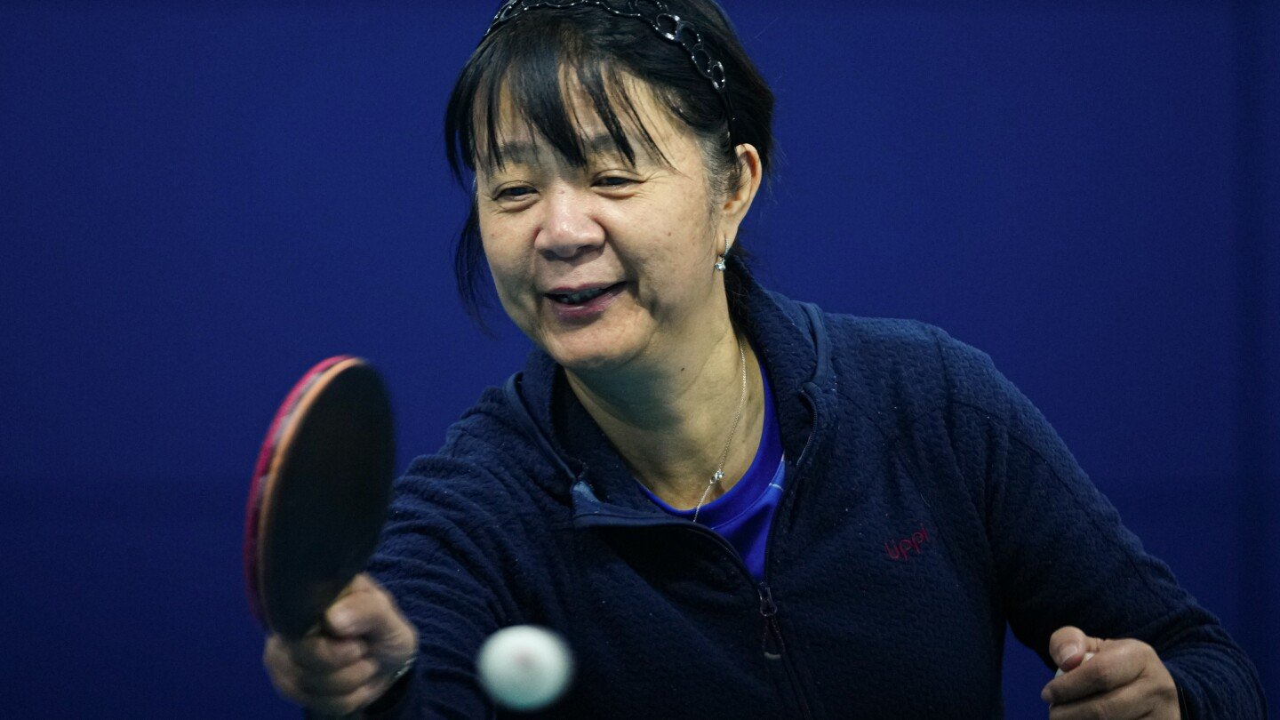 Chinese-Chilean table tennis player makes Olympics debut at age 58 in the Paris Games