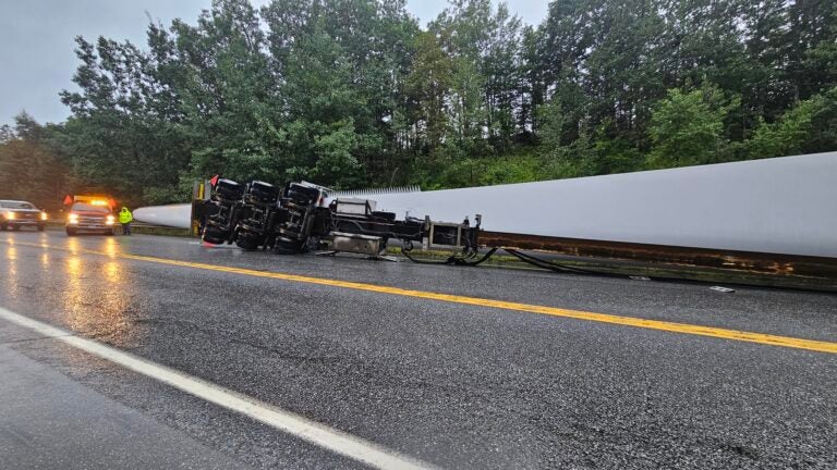 Giant wind turbine blade winds up on highway after truck hits Maine bridge