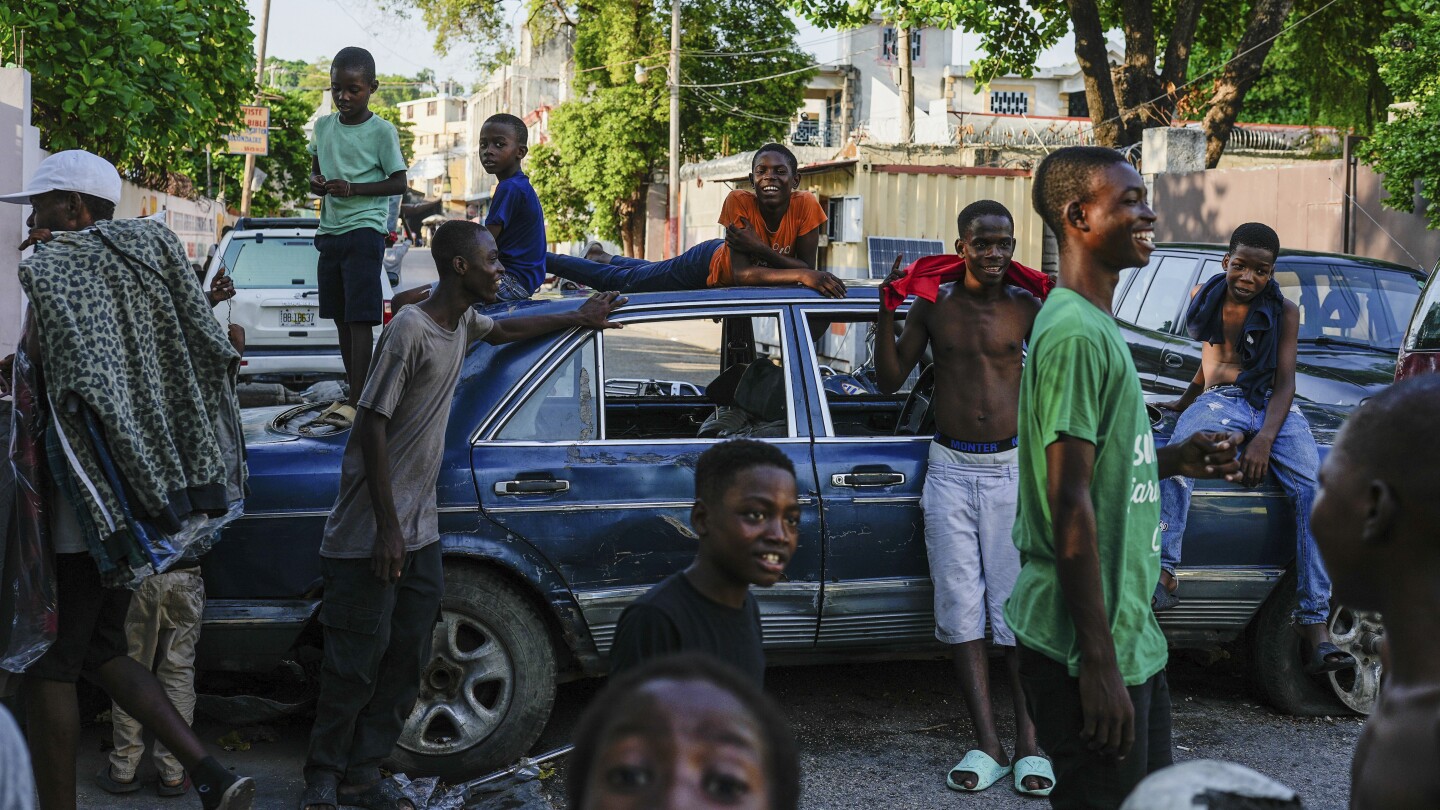 AP PHOTOS: In documenting violence in Haiti, you find bodies, but also ways people keep on living